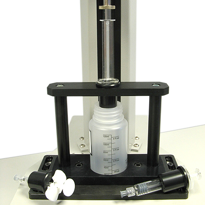 Syringe plunger compression force testing